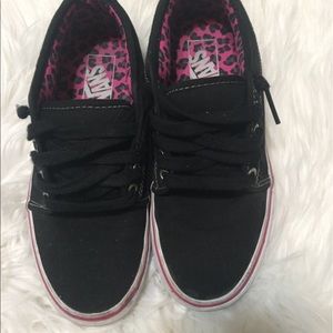 Black and pink Vans